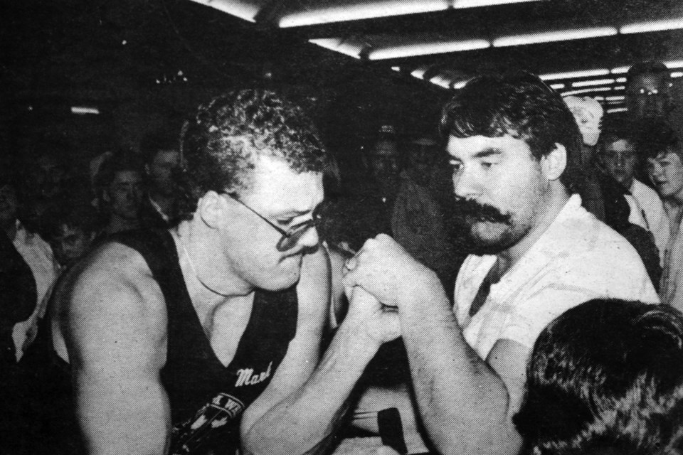 Mark Toporowskl of Hudson Bay and Ron Prebushewskl of Preeceville are ready to duel in armwrestling action at the Tisdale Mall Oct. 17, 1987.