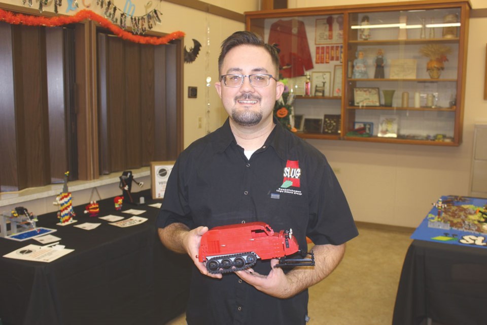 Chris Ursu shows off a snowmobile that he has built using Lego.