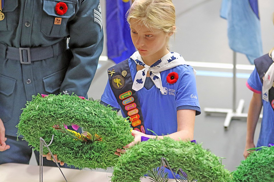 Jevinelle Klein lays a wreath on behalf of the Tisdale Girl Scouts.