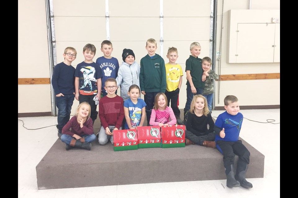 Members of the Benson 4-H Beef Club collected items for Operation Christmas Child. Pictured with the items are, back row, from left, Cruze Orsted, Jaxon Orsted, Dane Hogg, Cooper Hale, Keaton Walter, Brody Hogg, Turner Petterson and Waylon Petterson. Front row, Adeline Oleshko, Charlie Hayes, Hailey Petterson, Myah-James Kallis, Ellie Hayes and Preston Walter. Photo submitted