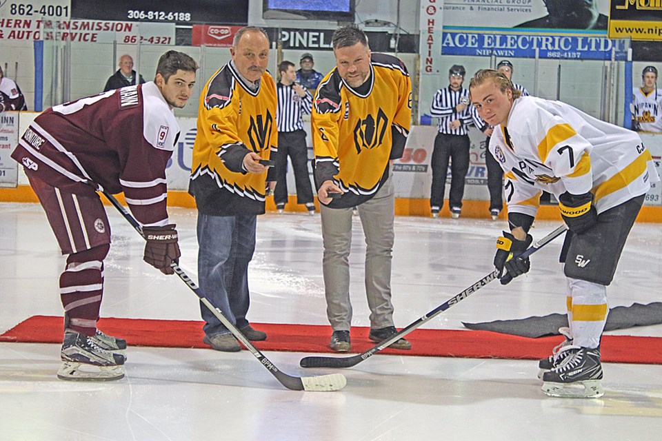 Bryan Trottier and Brian McGrattan ceremonially drop the puck during the Nipawin Hawks’ home game against the Flin Flon Bombers Nov. 17. The two former NHLers were the guest of honour at the Nipawin Hawks First Annual Sport Gala held Nov. 18. Review Photo/Devan C. Tasa
