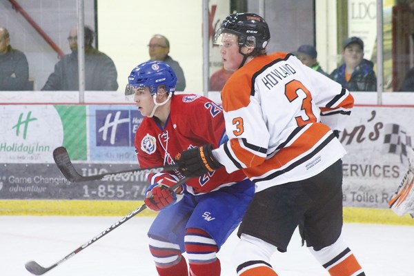 Terrier D-man Liam Hovland puts pressure on the Millionaires.