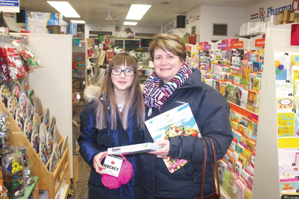 Kylie Phillipchuk, left, and Nicole Smiegel shopped at Henders Drugs during Moonlight Madness.