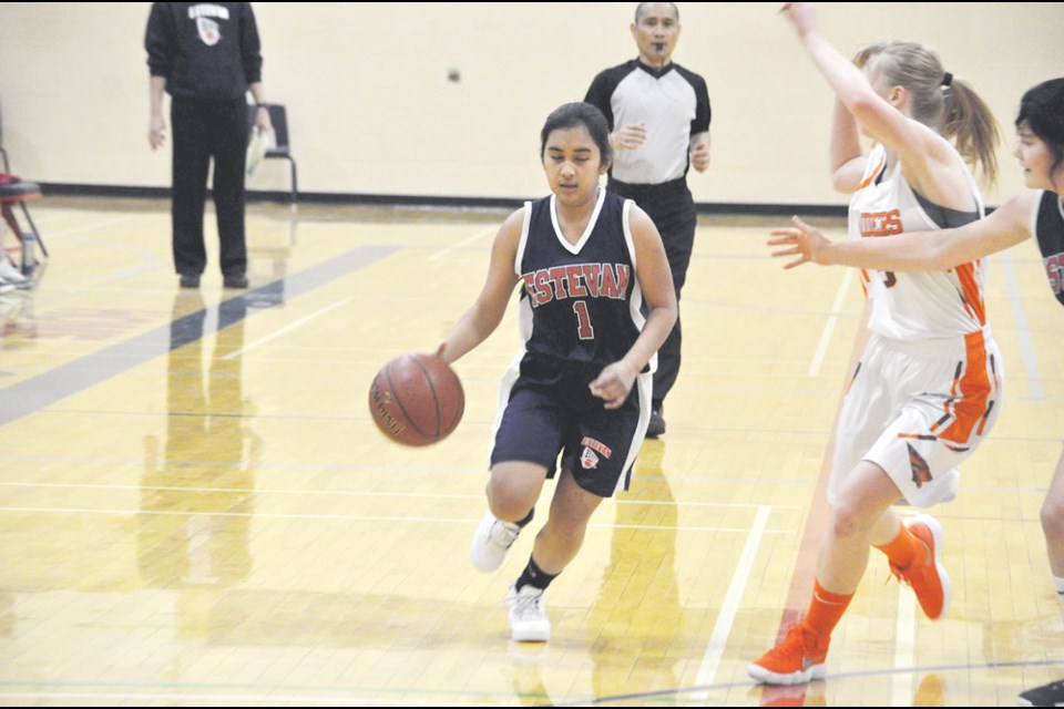 Princess Agbon dribbles the ball up the court.