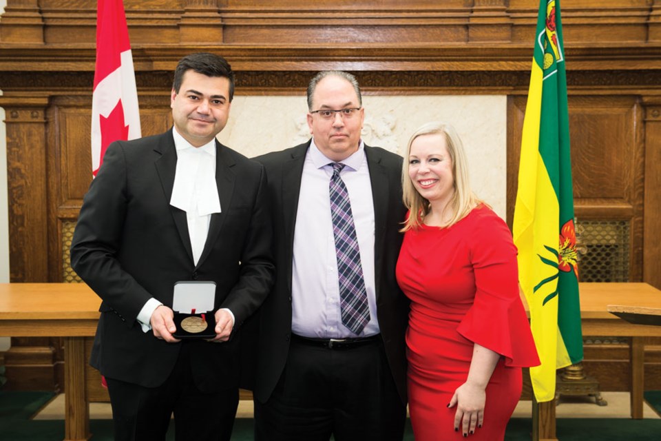 From left, Saskatchewan Speaker of the Legislature Corey Tochor, George Sereggela and Senator Denise Batters participated in presenting a Senate of Canada 150 medal to Sereggela.