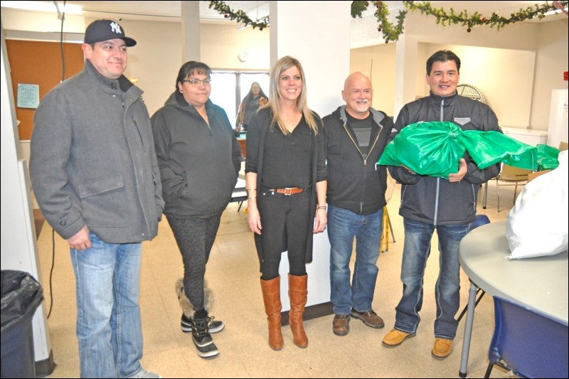 Chief Kenny Moccasin, Chief Crystal Okemow, Tracey Reimer, Kerry Reimer and Chief Bobby Cameron were at the Lighthouse where the FSIN made their annual donation of wild meat for Christmas. Photos by John Cairns