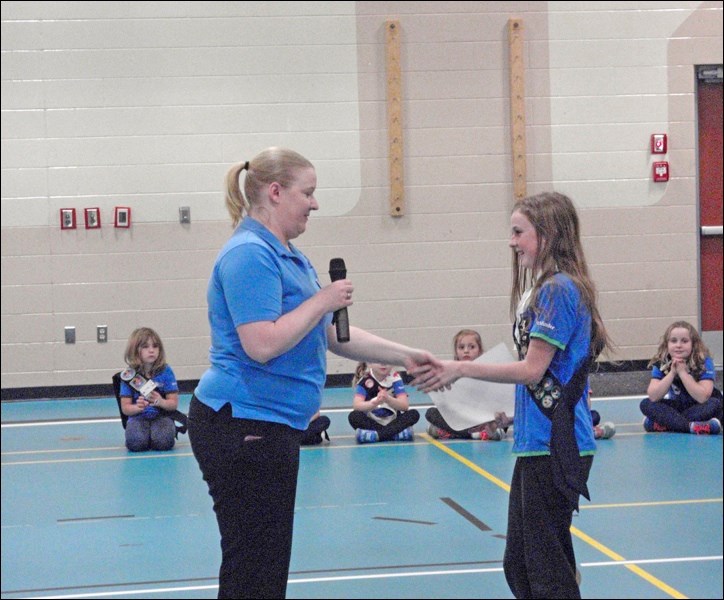District Commissioner Jenn Lefebvre presents two awards to Girl Guide Abbi Adair. Photos submitted