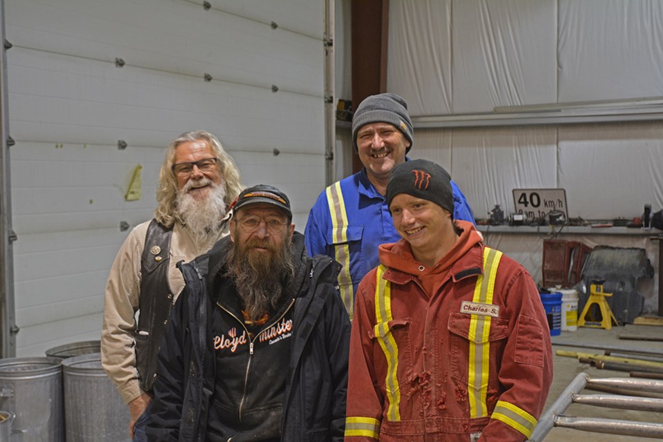 In back: camp director Harold Stephan, and ranch manager Ernest Salmond. In front: volunteer Larry Hubert, and ranch hand CJ Volk.