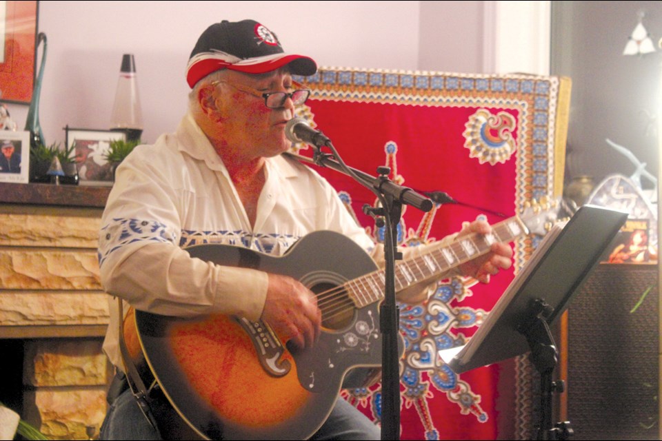 Ron Burwash plays at a Local Roots show in November. Over the past four decades, Burwash has earned a reputation locally as a gifted musician and a vocal supporter of Metis tradition. - PHOTO BY ERIC WESTHAVER