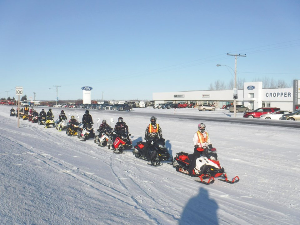 Prairie Women on Snowmobiles