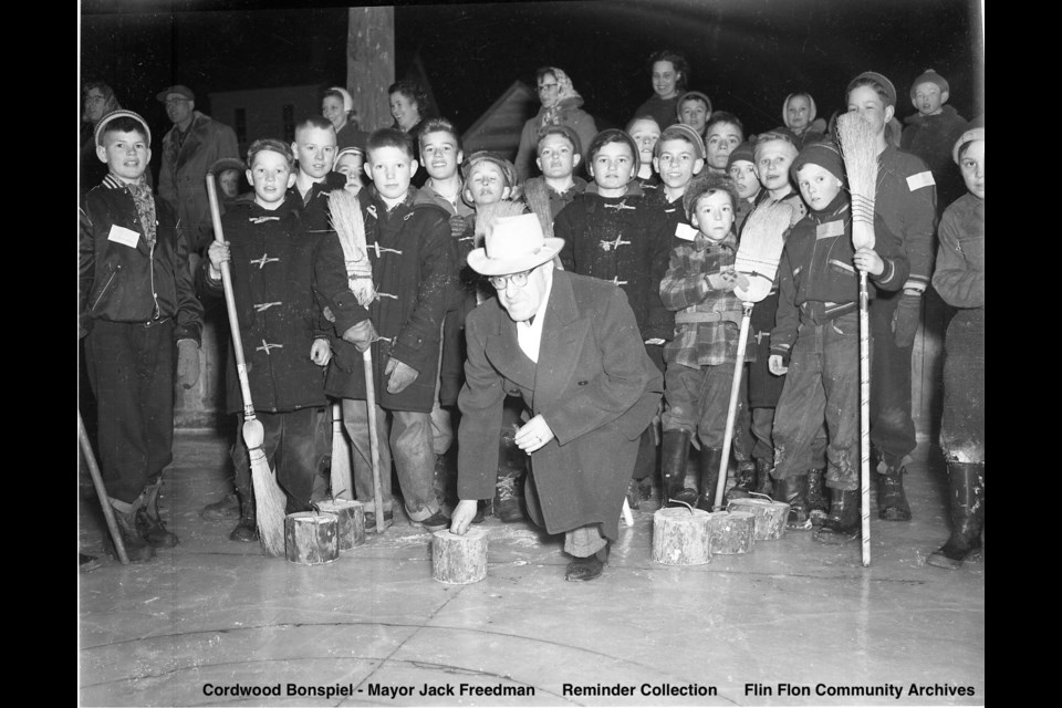 Mayor Jack Freeman throws the first rock during the Cordwood Bonspiel in 1952. - PHOTO COURTESY OF FLIN FLON HERITAGE PROJECT