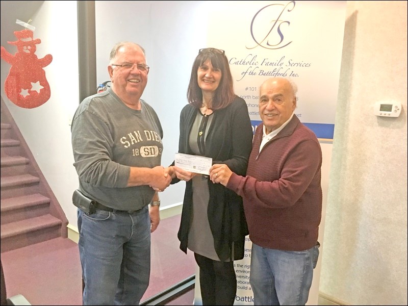 The local Kiwanis Club has made several donations to the community recently. From left to right, Dave Eckel, president of the Kiwanis Club of the Battlefords, Karen Richard, executive director of Catholic Family Services and Don Backus, Kiwanis member presenting a cheque for $2,500.