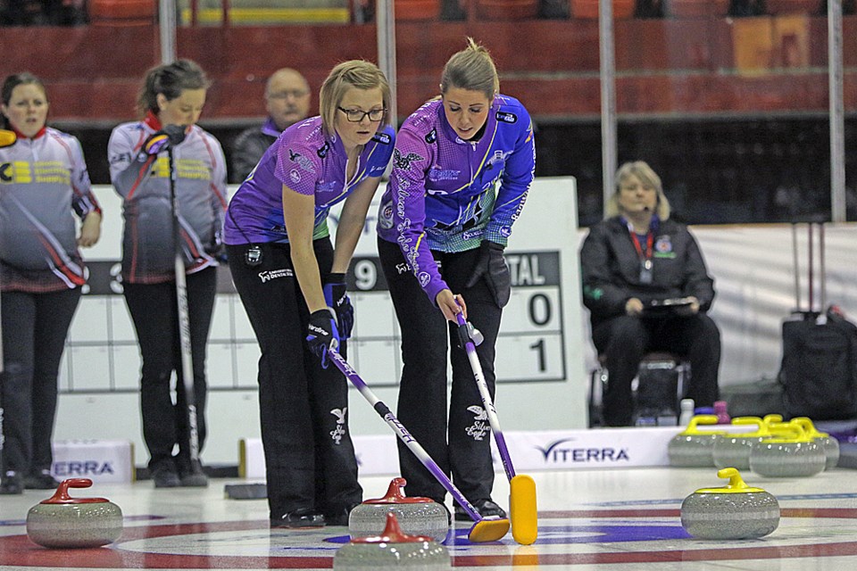 Team Silvernagle strategizes during Draw 7 of the Viterra Scotties Women's Provincials. Team Silvernagle is locked in a battle with Team Eberle for first place. Review Photo/Devan C. Tasa