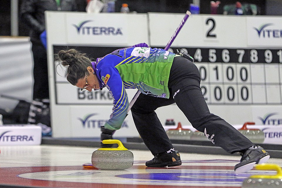 A member of Team Silvernagle sweeps one of Team Eberle's rocks away during the 1 vs. 2. game of the 2018 Viterra Scotties Women’s Provincials Jan. 6. Review Photo/Devan C. Tasa