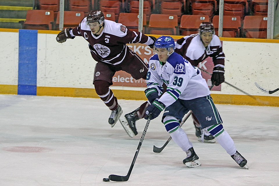 Reed Gunville of the Melfort Mustangs advanced with the puck during the home game against the Flin Flon Bomber Jan. 9.