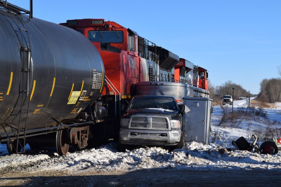 Vehicle collides with train