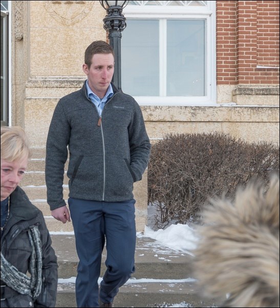 Sheldon Stanley, Gerald Stanley's son, leaves the courthouse at noon after testifying.