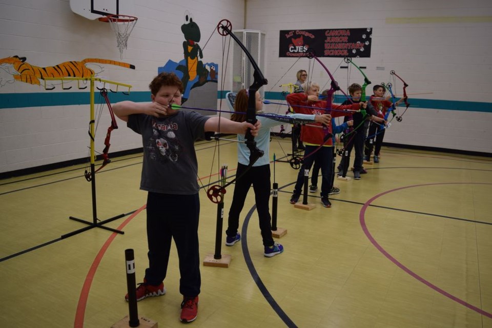 The National Archery in the School Program (NASP) at Canora Junior Elementary School (CJES) received a donation of $1,000 from the Canora branch of the Saskatchewan Wildlife Federation on January 24. Among those taking part in archery practise that day from left, were: Jordan Makowsky, Katherine Hauber, Kale Strelioff, Braidyn Nesbitt and Cooper Kraynick. The supervisor was Jennifer Prychak, coach.