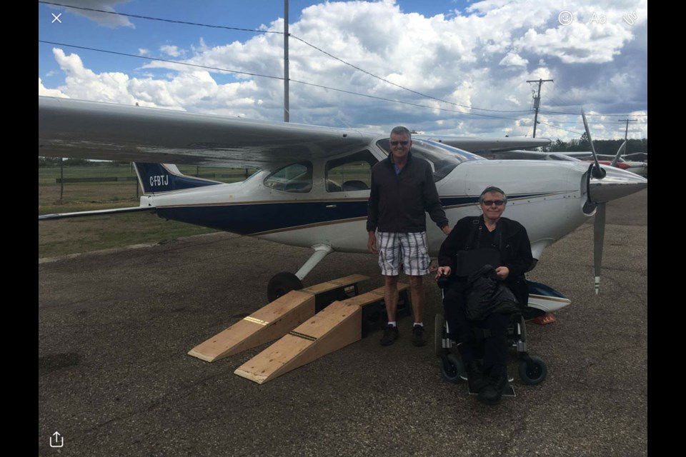 Ken Johnson, right, pictured here with his friend John Erickson, has purchased an airplane, and has taken many flights in the plane. Photo submitted
