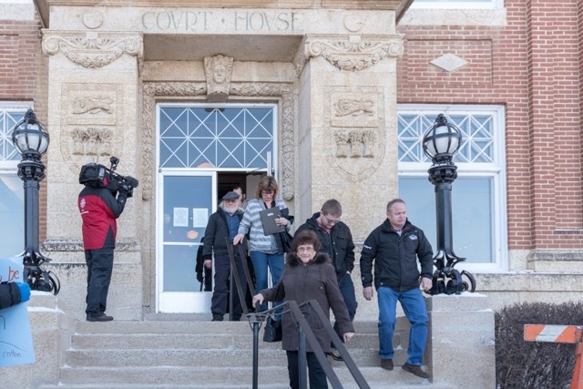 People leaving the courthouse for the lunch break.