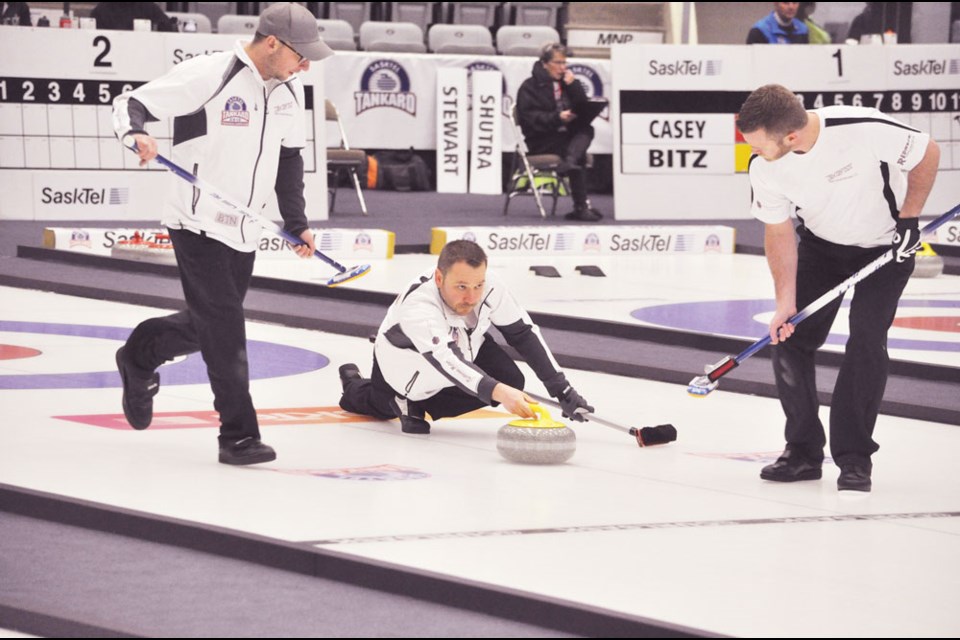 Skip Brent Gedak from the Power Dodge Curling Centre, flanked by Shawn Meyer (left) and Derek Owens (right).