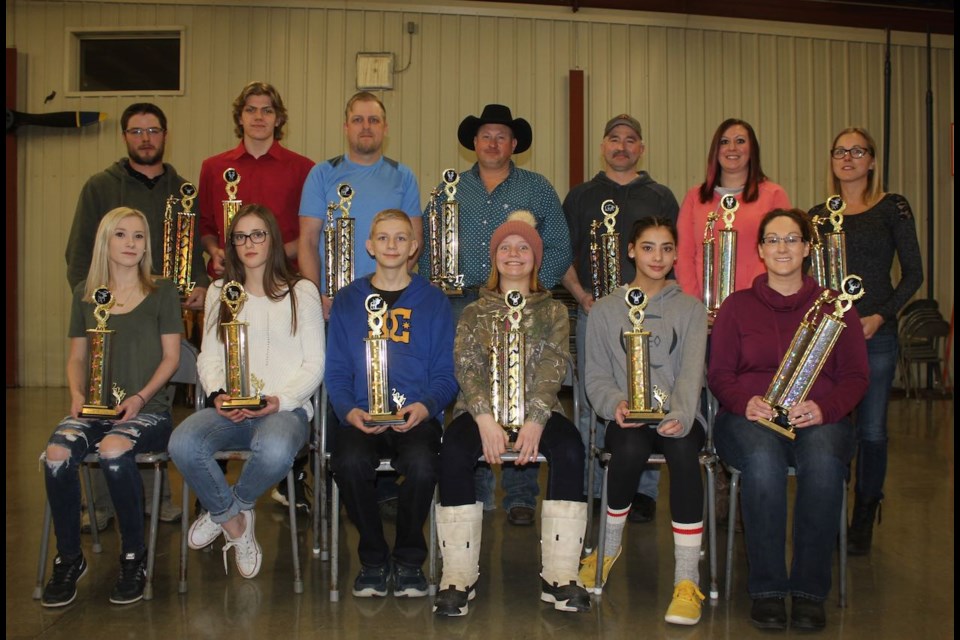Winners in the big game hunting were, back row, from left, Adam Van de Woestyne, Kolby Janssen, Jarett Mosley, Lyle Daoust, Mike Halirewich, Jamie Hansen and Courtney McKinnon. Front row, from left, McKenna Van de Woestyne, Mackenzie Skuce, Donavan Dyer, Krislyn Pylychaty (accepting for Riley Pylychaty), Jaslynn McNabb and Stacey Potoma. 5) Photography contest winners were, from left, McKenna Van de Woestyne, Doug Van de Woestyne and Mary Jacobs.