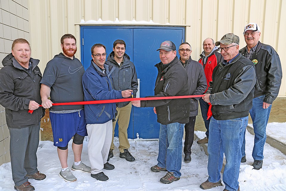 The Tisdale Senior Ramblers hockey team and the Tornados football team held a grand opening of their new dressing room Feb. 1. From left are Kim Gisi, Keenan Carrier, Brian Ofukany, Jordan Lam Ma, Neil Elmslie, Tim Markwart, Dwight Marleau, Charlie Fritshaw and Wayne Styan. Review Photo/Devan C. Tasa