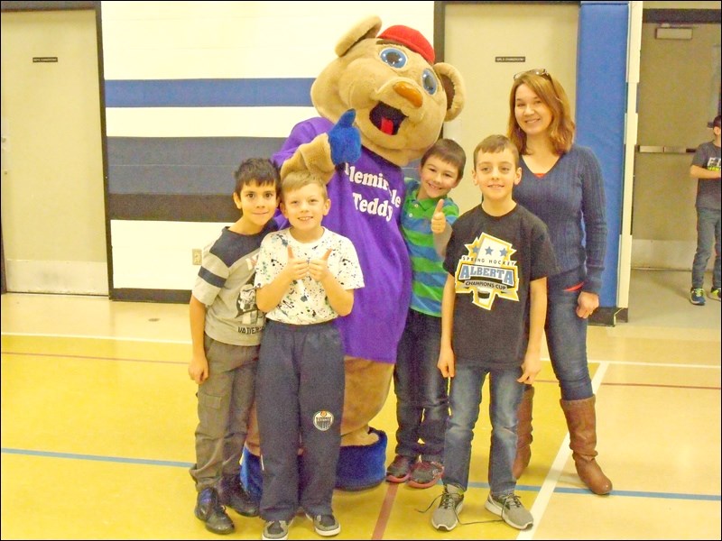 Telemiracle Teddy at Borden School with Mrs. Terri Troupe-Logue on Feb. 15 and handed out candy to the students. Photos by Lorraine Olinyk