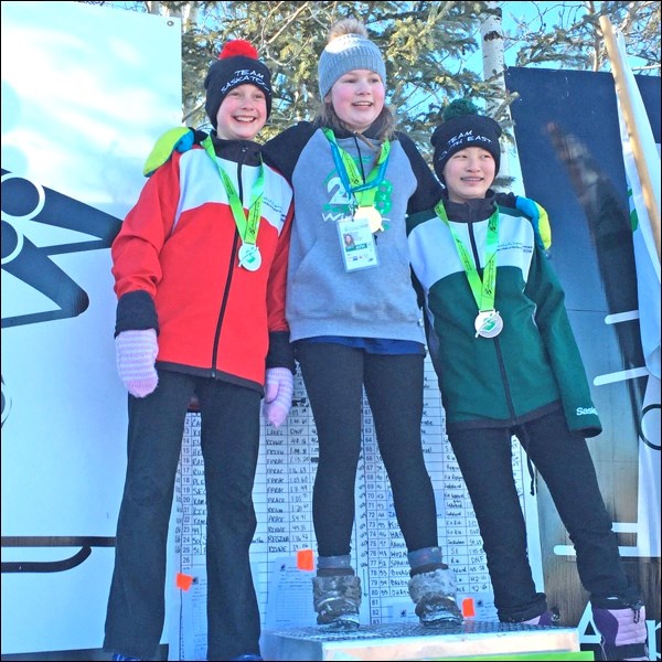 Gold medal winner and alpine ski participant, Alexis Elder enjoying her win with fellow competitors. Photo submitted by Sherri Solomko