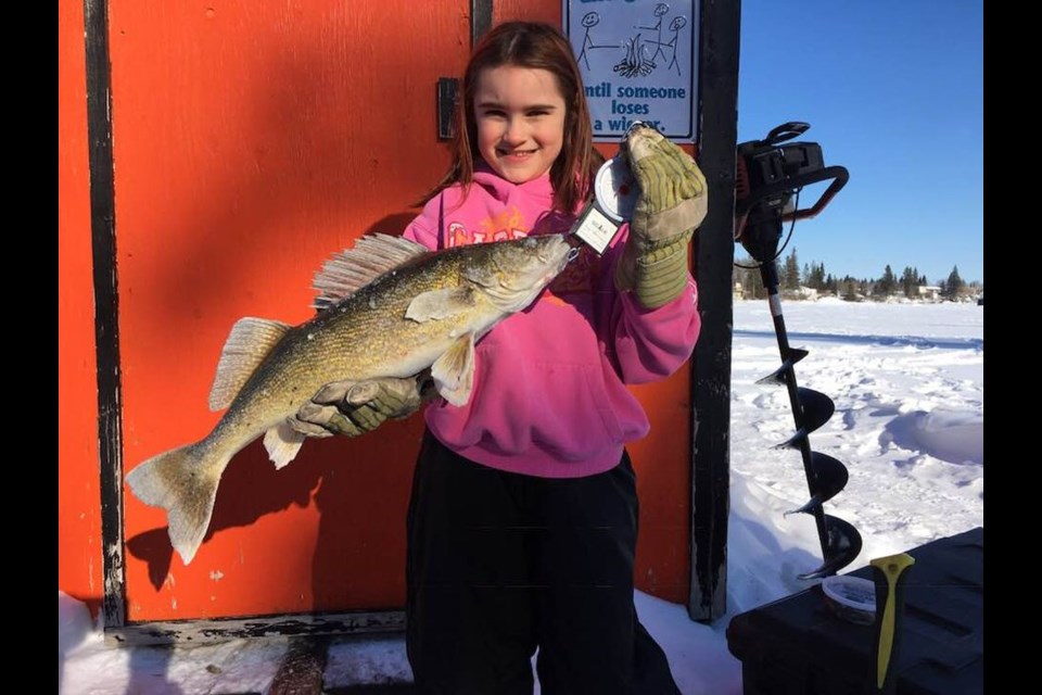 Peyton Lisoway of Preeceville was excited to have caught a five-pound walleye at Nelson Lake on February 22.