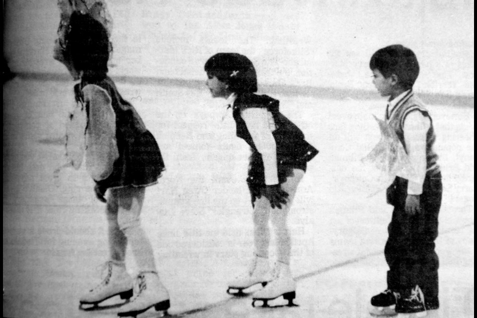 Three young members of the Sylvania Figure Skating Club perform at their carnival held Feb. 21.