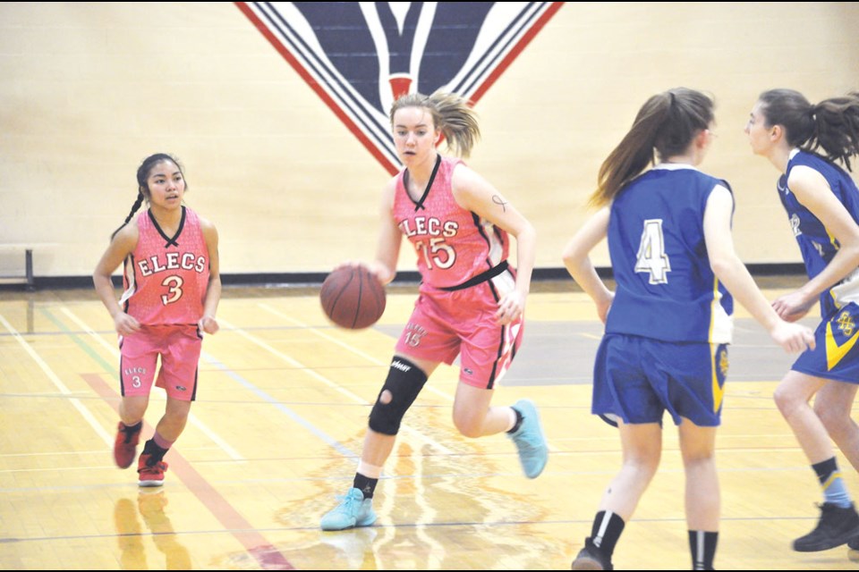 Bethany Montebon (3) and Haylee Jones (15) look for shooting opportunities.