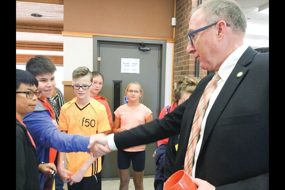 Grade 7 students from St. Mary’s School spoke to Mayor Roy Ludwig about Orange Shirt Day and residential schools. Photo submitted