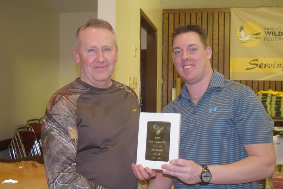 Glen Becenko, left, of Kamsack was presented with three awards at the Kamsack SWF awards banquet on February 24 by Tyson Leis. He was recognized for having taken the best non-typical elk, the best typical white-tailed deer and the best typical mule deer.