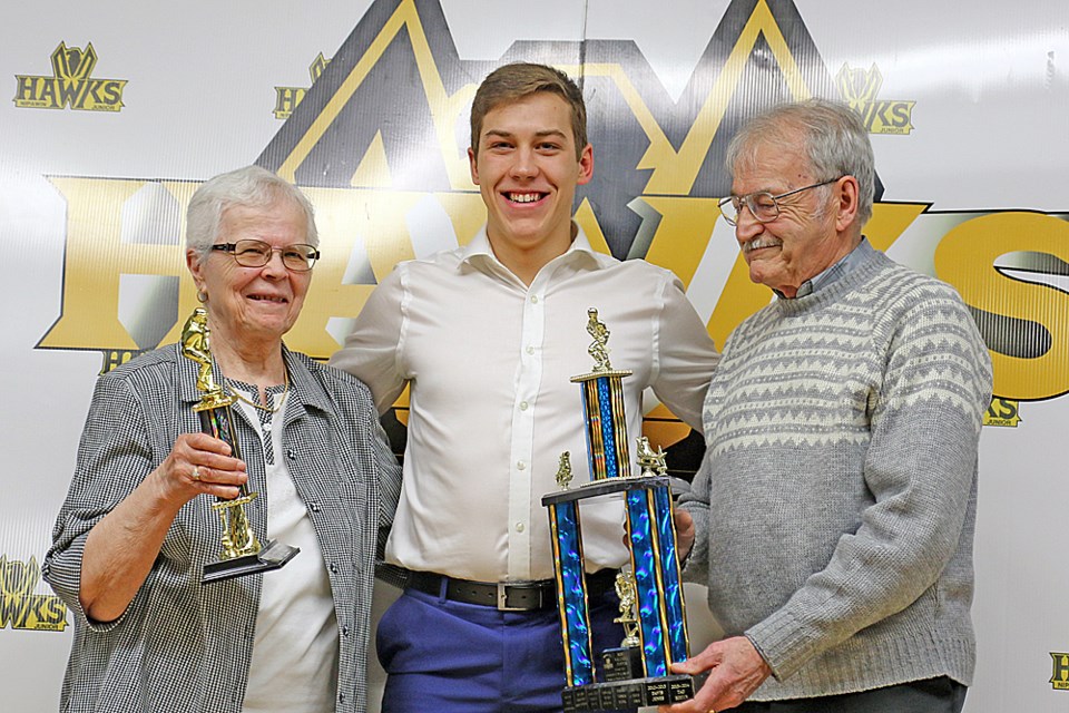 Josh McDougall received four awards at the Hawks' awards banquet, including Most Valuable Player, which he's receiving in this photo. There were 17 awards presented at the March 10 event. Review Photo/Devan C. Tasa