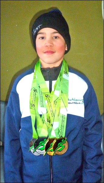 Alan and Laura Tucker’s grandson Rio with his four medals.