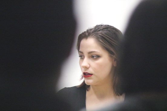 Bailey Lemcke takes a pause during her monologue as the crowd watches. Her piece, called ‘Entitled,’ details a woman’s experience with harassment at a bar. Lemcke was part of the Womanologues event on March 8 at the Old Land Titles Building. The event paid tribute to International Women’s Day.