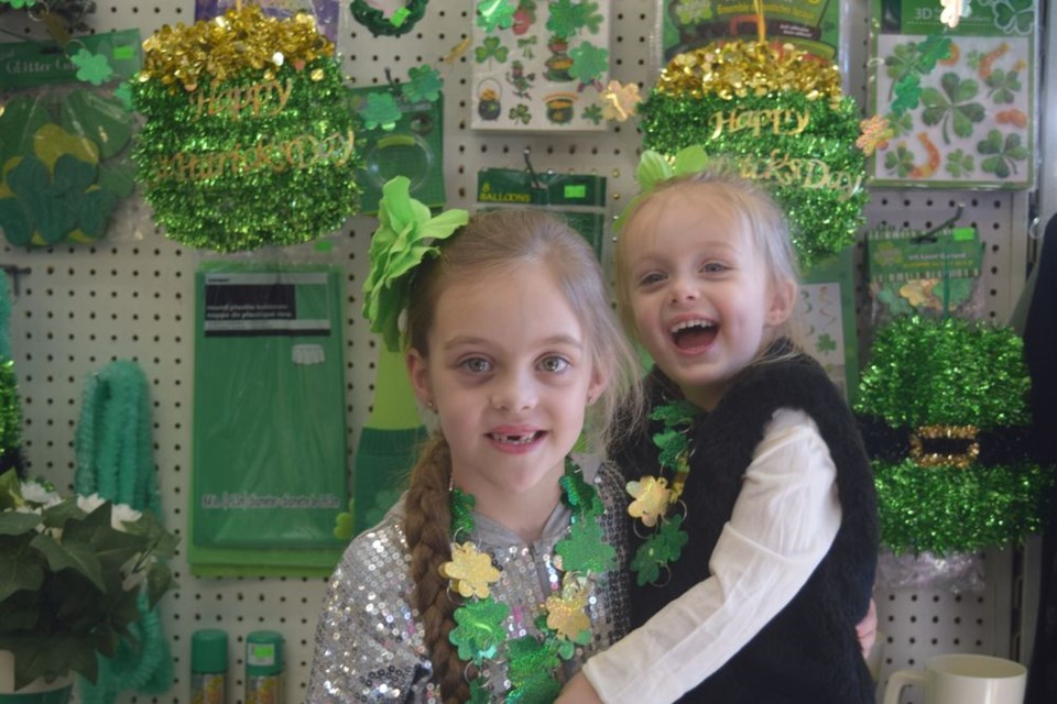 Among district residents who were thinking green this week in honour of St. Patrick’s Day, which is being observed on Saturday (March 17), were sisters Eden, left, and Asia Rushton who were photographed in front of a display of Irish-themed knick-knacks at Buck’s Dollar Store in Kamsack.