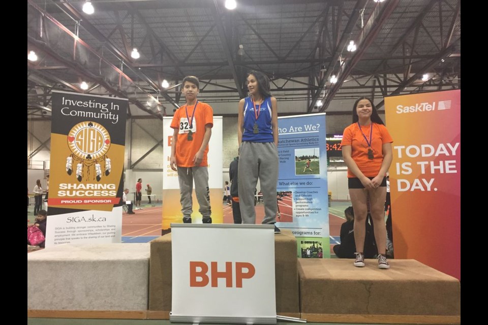 Tied for the gold medal in the 60-metre race at Saskatoon recently were Petrie Whitehawk (centre right) of Kamsack and her cousin Brin Cote (centre left). Placing third in the competition was Josie LaFramboise.