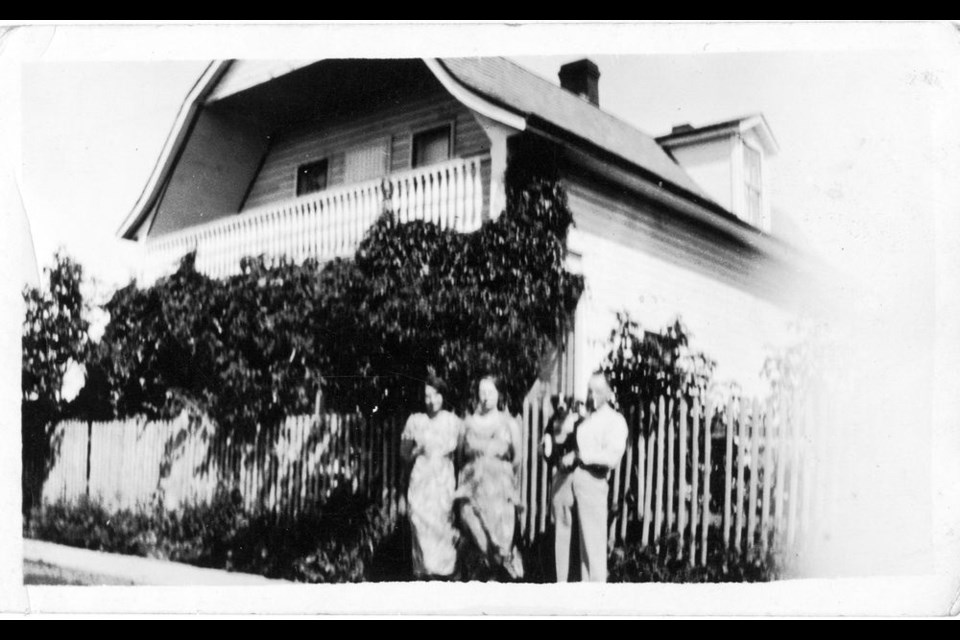 The Britski family is seen at the Doukhobor-built dwelling house, Second Avenue, circa 1926. - Image courtesy Laurie Britski family.