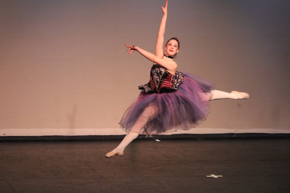 Kaitlyn Landstad leaps across the Sacred Heart High School stage during her jazz solo performance. She was part of Extravadance Studio’s Solo and Duet Showcase on Mar. 25. Dozens of dancers grooved to hip-hop, tap, ballet, and contemporary styles.