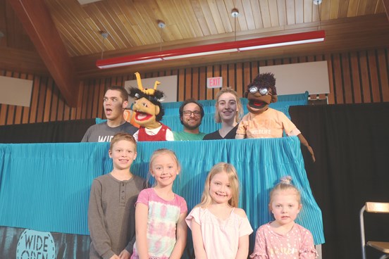 Yorkdale students pose with actors and puppets after a show on Friday, Mar. 23. Wide Open Children’s Theatre brought laughs and lessons to the school with their hour-long puppet show. The play, titled “Very Merry Munsch,” retold classic Robert Munsch stories with over 25 puppets and audience participation.