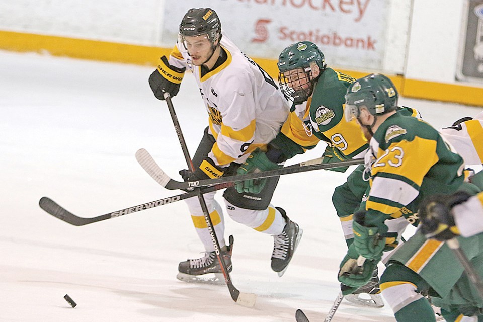 Humboldt Broncos forward Graysen Cameron keeps a watchful eye on Nipawin Hawks forward Grant Baetsen. Cameron and his Broncos teammates enjoyed a solid night 5-on-5 as the shut out the Hawks, but four power play goals and a shorthanded goal was the Broncos’ undoing as they fell 5-3 and now trail their semi-final series 2-0. photo courtesy of Devan C. Tasa