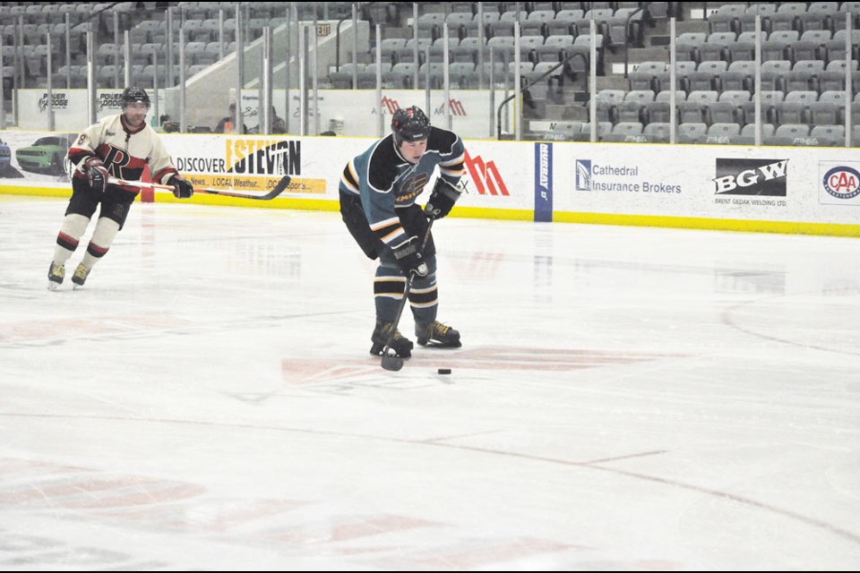 Chris Walsh of the Estevan 1124 Sharks skates in on a breakaway Sunday at Affinity Place.