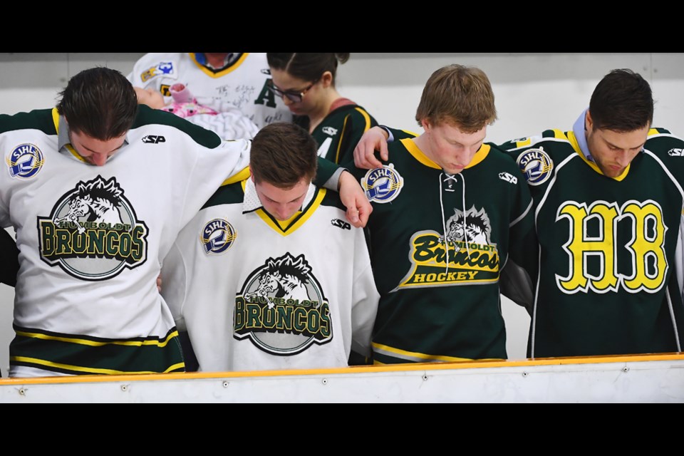 Former members of the Humboldt Broncos stand arm-in-arm as a show of unity during the vigil held at the EPA on April 8. Unity has been a common theme in Humboldt and area as members of the community have come together to mourn the loss of 15 members of the Broncos, and pray for the 14 others who were injured as a result of the devastating bus accident on April 6. Humboldt Journal/Jonathan Hayward POOL