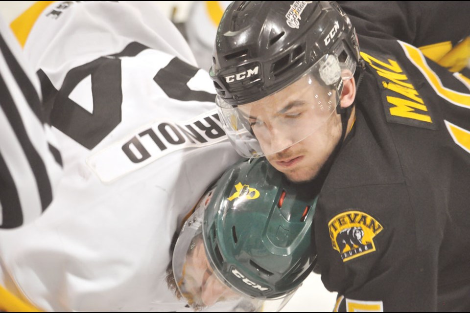 Nipawin’s Brandon Arnold and Tanner Manz tie up after a faceoff in Nipawin.