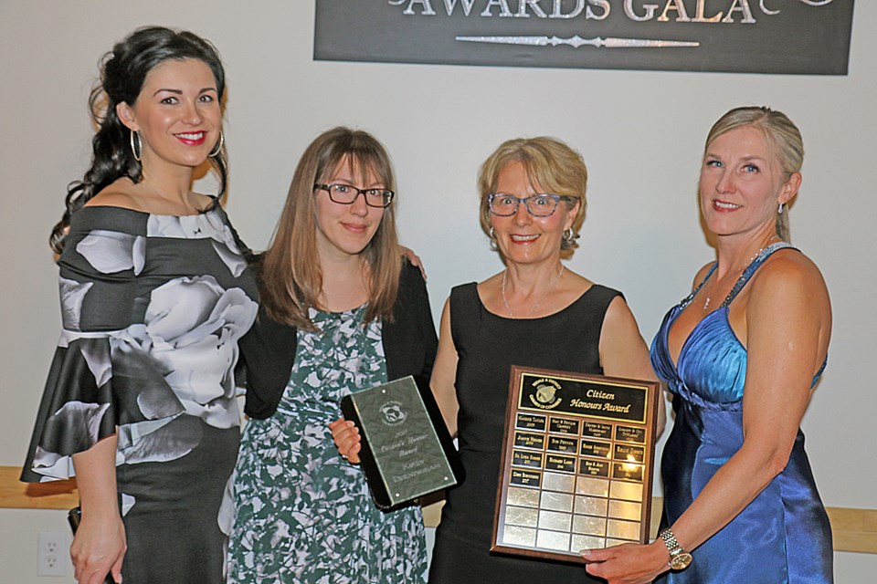 Kirby Burningham received citizen’s honour at the Tisdale Chamber of Commerce’s Imprints of Success gala for his community efforts over a period of three decades. Accepting the award is his daughter Sarah, centre left, and wife Diane, centre right. Photo by Devan C. Tasa