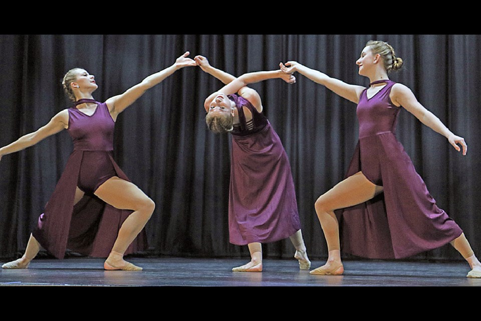 Nicole Becker, Cassidy Greif and Danae Harpham perform their graduating dance at the Tisdale Dance Centre’s recital May 6. Photo by Devan C. Tasa