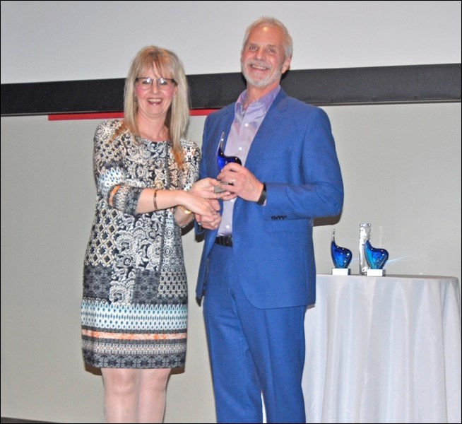 The Champions of Mental Health Supportive Employee award went to Battlefords Publishing Ltd. Publisher Gord Brewerton accepted the award on behalf of the company from Linda Shynkaruk.
