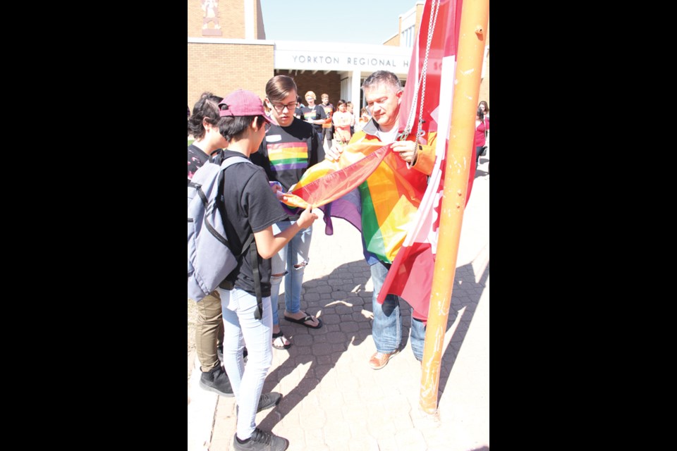 The Yorkton Regional High School in conjunction with The Good Spirit School Division hosted their first ever Gay-Straight Alliance Youth Summit Saturday. The opening ceremonies included welcoming remarks from Principal Mike Haczkewicz, and greetings on behalf of the city from Mayor Bob Maloney. Laura Budd spoke about the celebrations happening around the city and area during Yorkton Pride Week which has been proclaimed May 12 to 20 and the Diamond Willow Drum group performed two songs during the flag raising. The day consisted of workshops with speakers from fYrefly, OUT Saskatoon, and Moose Jaw Pride. The theme of the summit was titled ‘Growing our Garden’ and was symbolic for the need of inclusion for all students within our schools. The impact of the summit was made clear by the students attending leaving remarks such as “It was great to get so many like-minded people together in one place. What an excellent community,” “This was an amazing learning experience for our students and teachers. It was so powerful and moving seeing so many students working towards making the world a more loving, accepting place.”